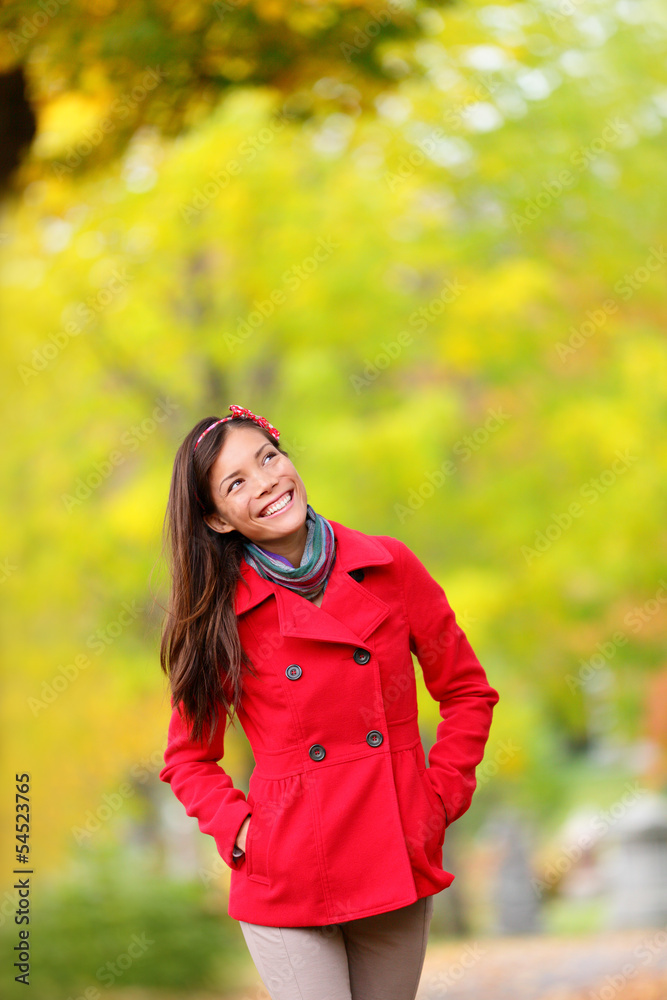 Thinking autumn woman looking up in fall forest Thinking autumn woman looking up in fall forest