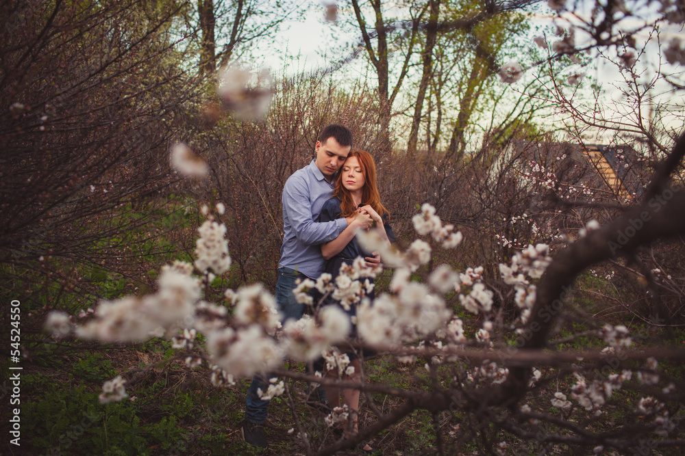 couple hugging in the garden couple hugging in the garden