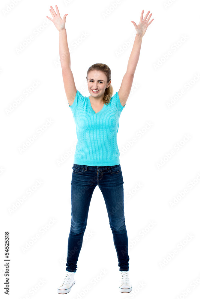 Joyous female raising arms in excitement Joyous female raising arms in excitement