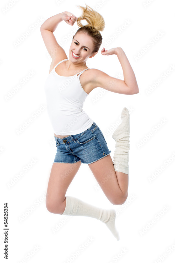 Attractive girl jumping with joy