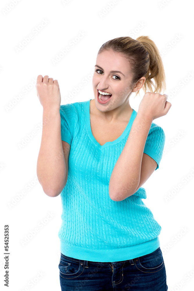 Excited charming girl with clenched fists Excited charming girl with clenched fists