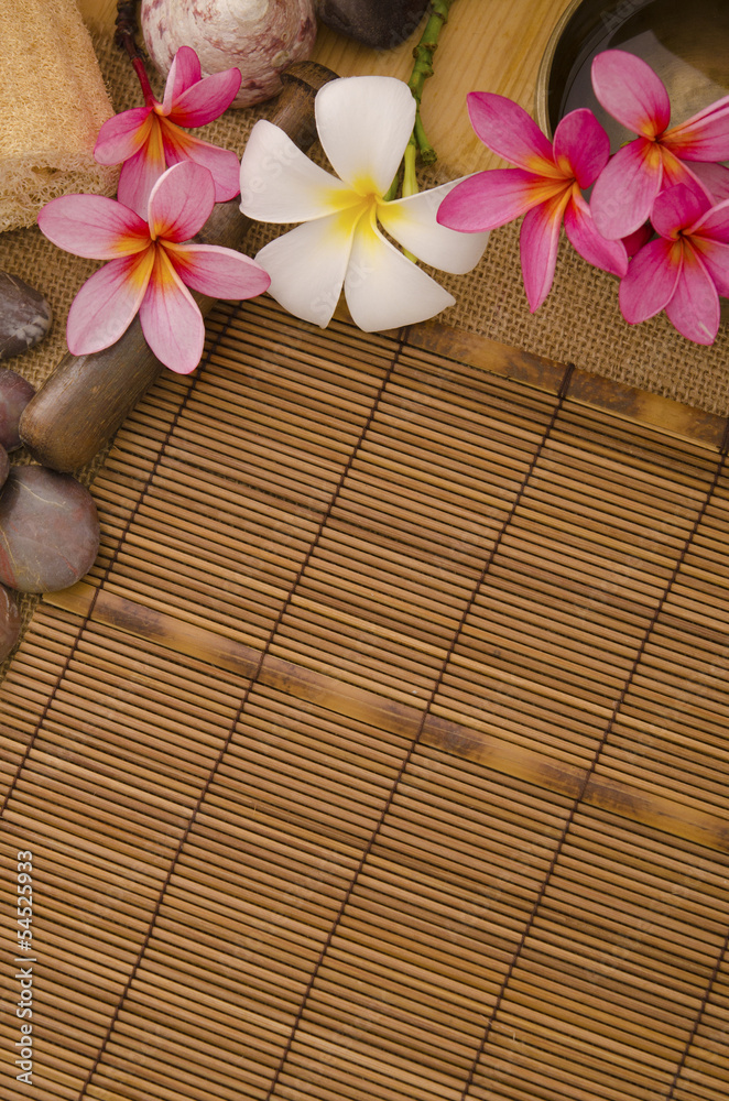 tropical spa setup with traditional frangipani flower and massag tropical spa setup with traditional frangipani flower and massag