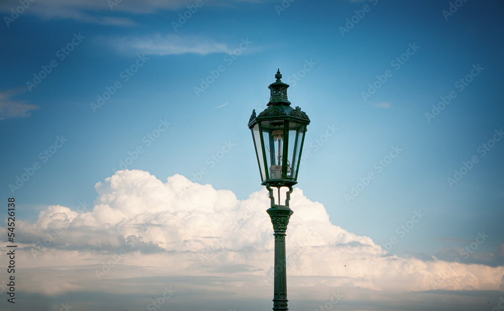 Street lamp in front of cloudscape