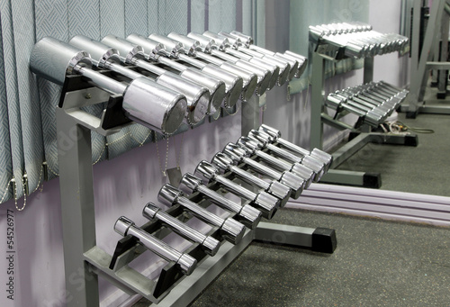 Steel Dumbbells and reflection in mirror