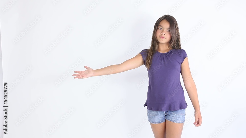 Smiling cute little girl showing hand isolated Smiling cute little girl showing hand isolated