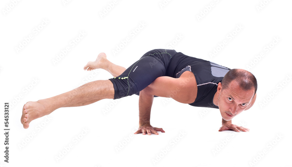 Practicing Yoga exercises:  Challenge Pose - Koundiyanasana