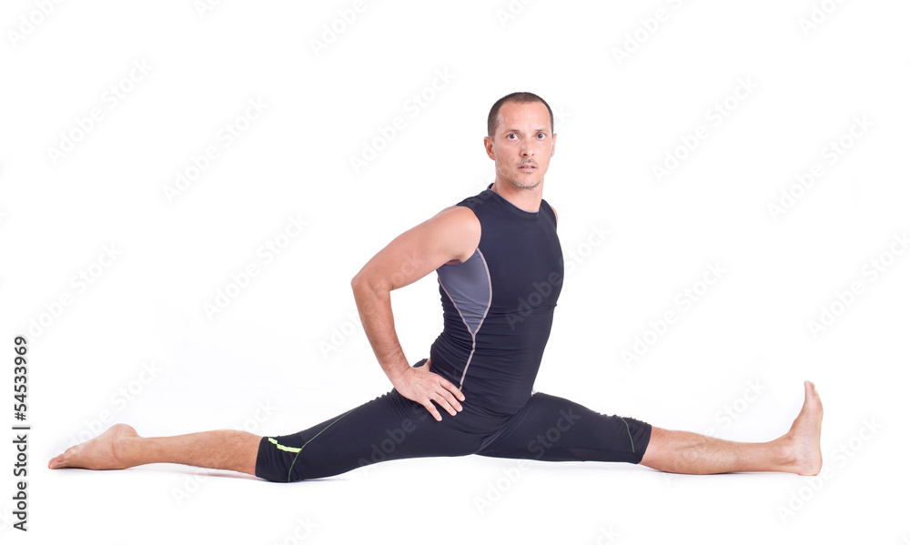 Practicing Yoga exercises: Monkey Pose - Hanumanasana Practicing Yoga exercises: Monkey Pose - Hanumanasana
