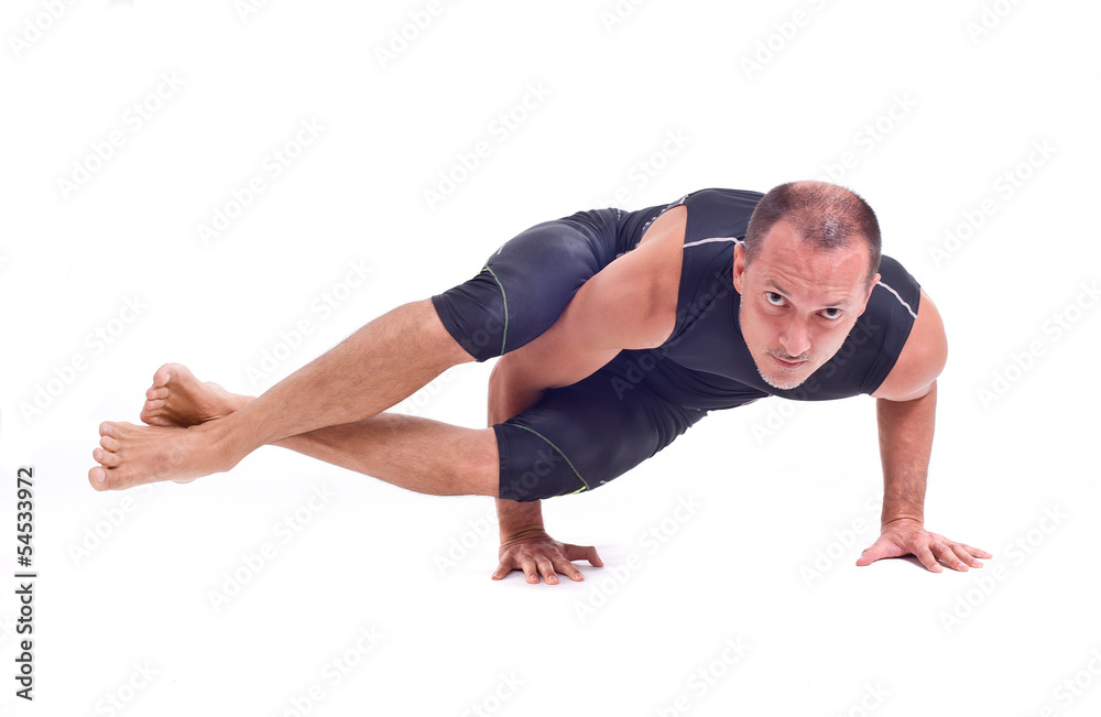 Practicing Yoga exercises: Eight Angle Pose - Astavakrasana Practicing Yoga exercises: Eight Angle Pose - Astavakrasana