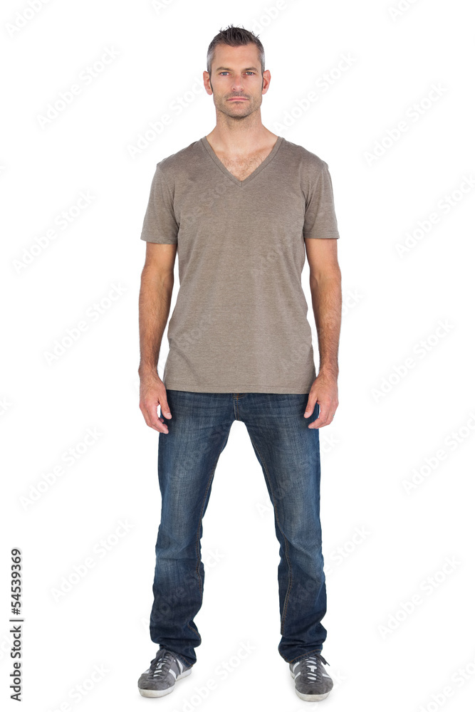Serious standing man looking at the camera Serious standing man looking at the camera