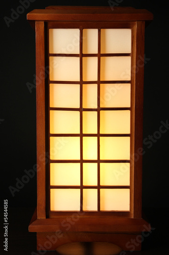 Japanese table lamp on black background