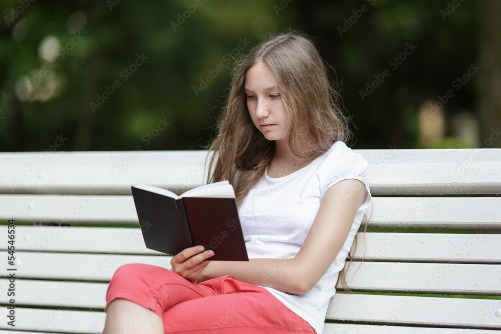young girl reading book young girl reading book