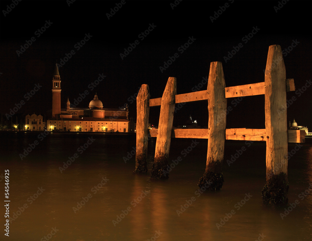 Mooring Posts in a Venetian canal at night