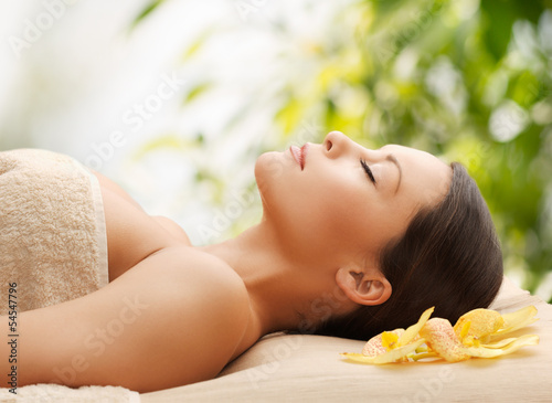 woman in spa lying on the massage desk