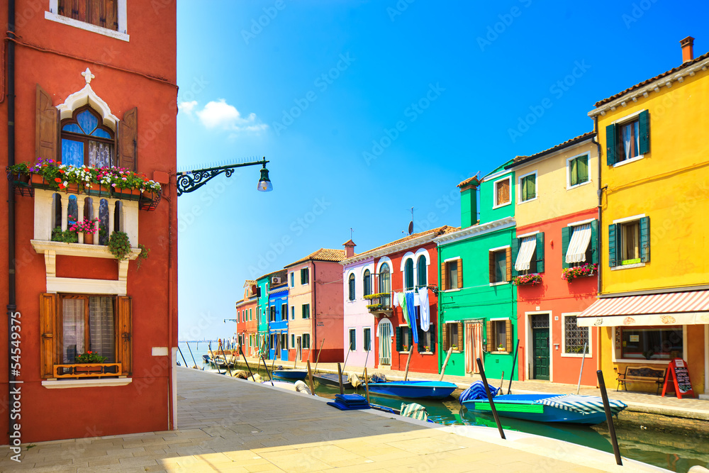 Venice landmark, Burano island canal, houses and boats, Italy