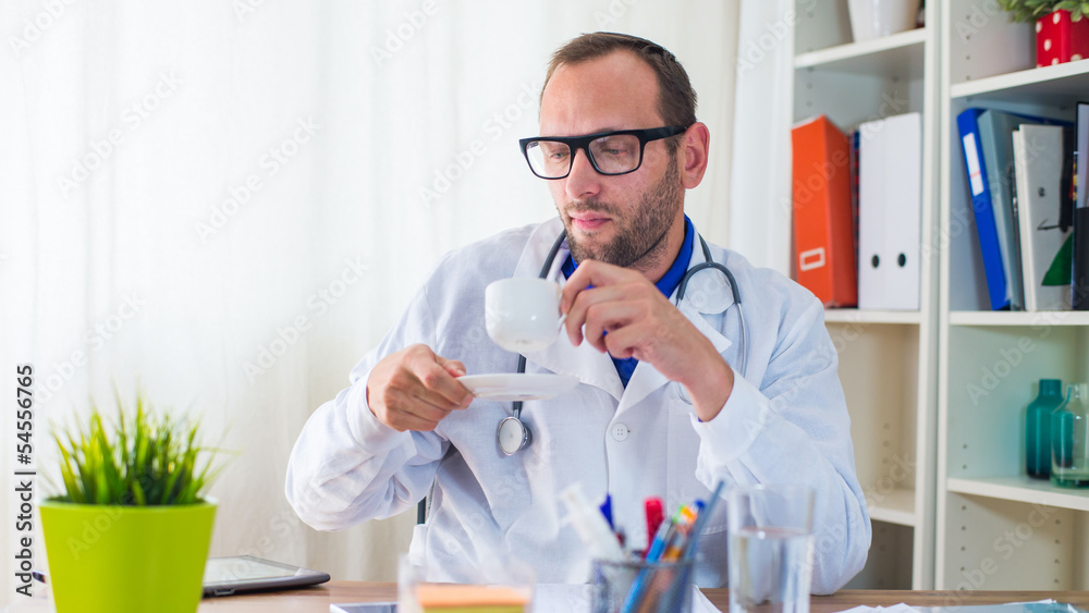 Closeup portrait of male doctor with coffee. Closeup portrait of male doctor with coffee.
