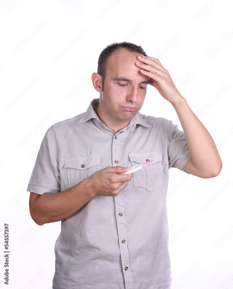 sad man with pregnancy test