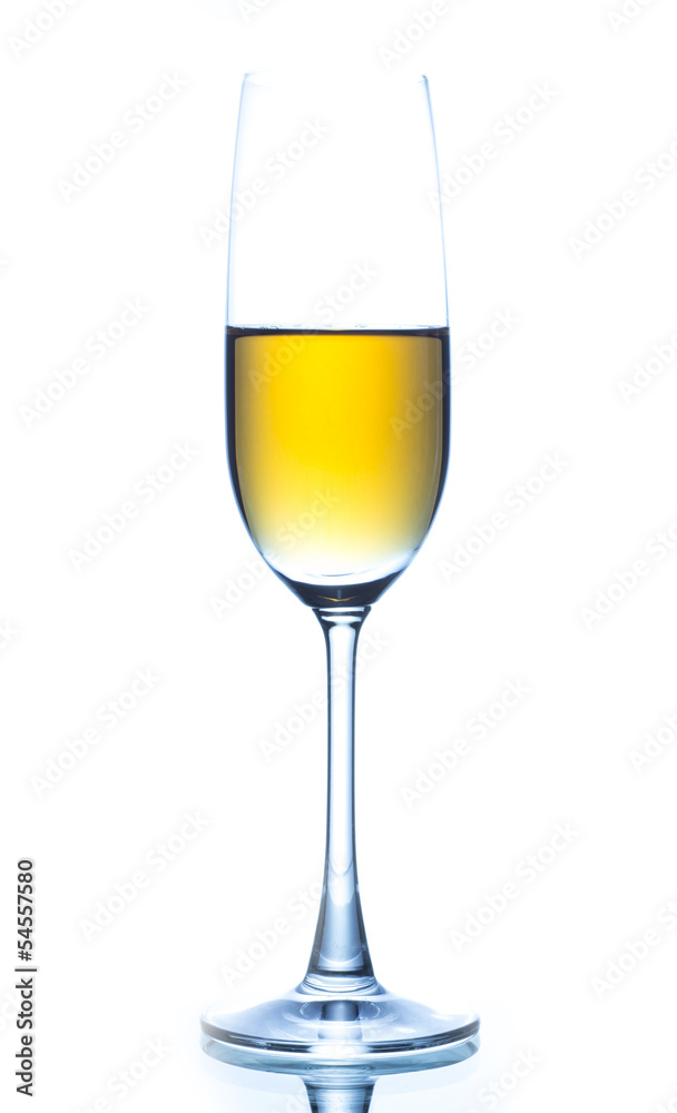 Elegant wine glass full of amber coloured wine on a white backgr