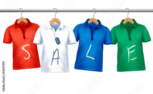 Shirts with price tags hanging on hangers. Concept of discount s