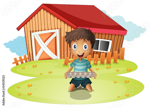A boy holding an egg tray