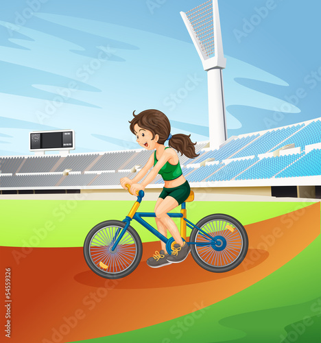 A girl biking at the field