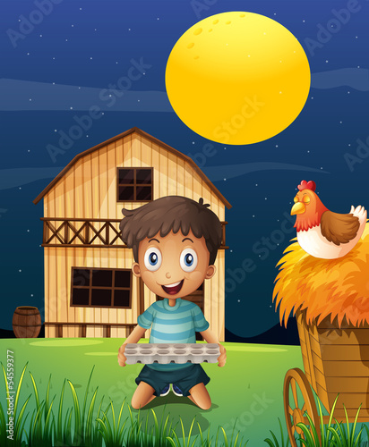 A boy collecting eggs in the evening
