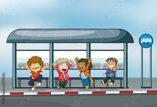Four happy kids at the waiting shed