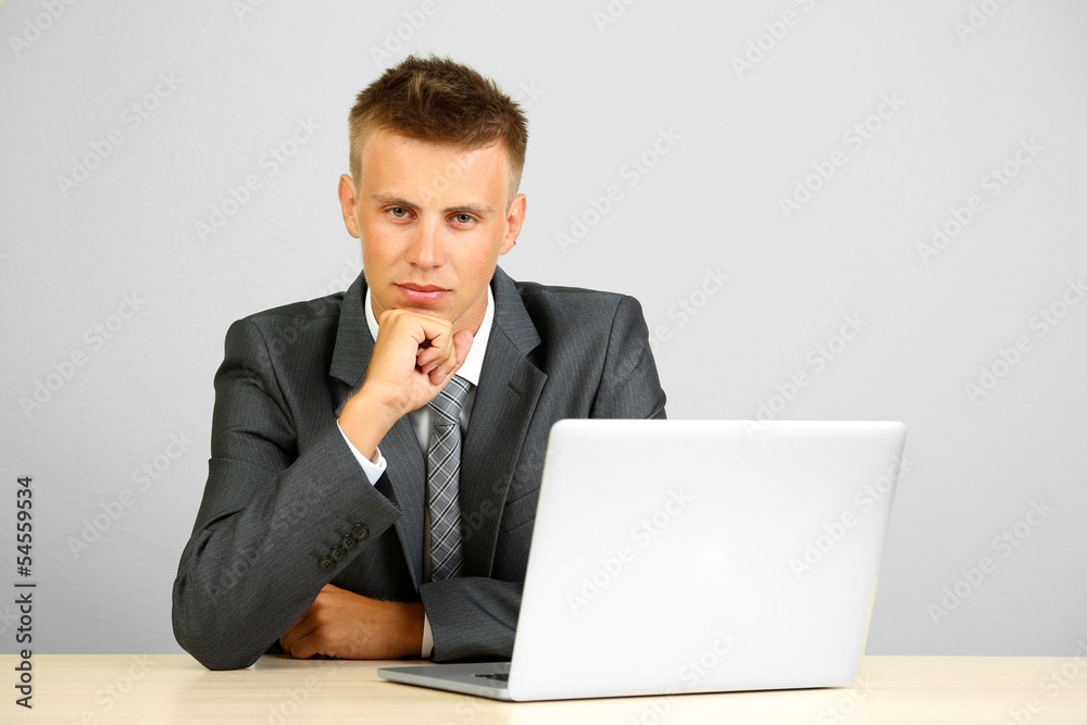 Portrait of young businessman working in office Portrait of young businessman working in office