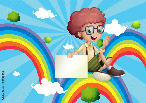 A boy above the rainbow holding an empty board