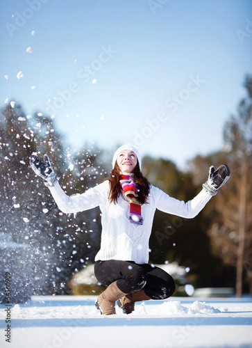 Girl playing with snow