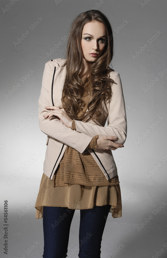 Lovely young woman in elegant clothing posing gray background Lovely young woman in elegant clothing posing gray background