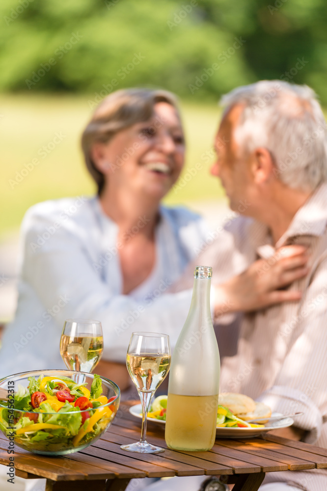 Senior wife and husband dining outdoors Senior wife and husband dining outdoors