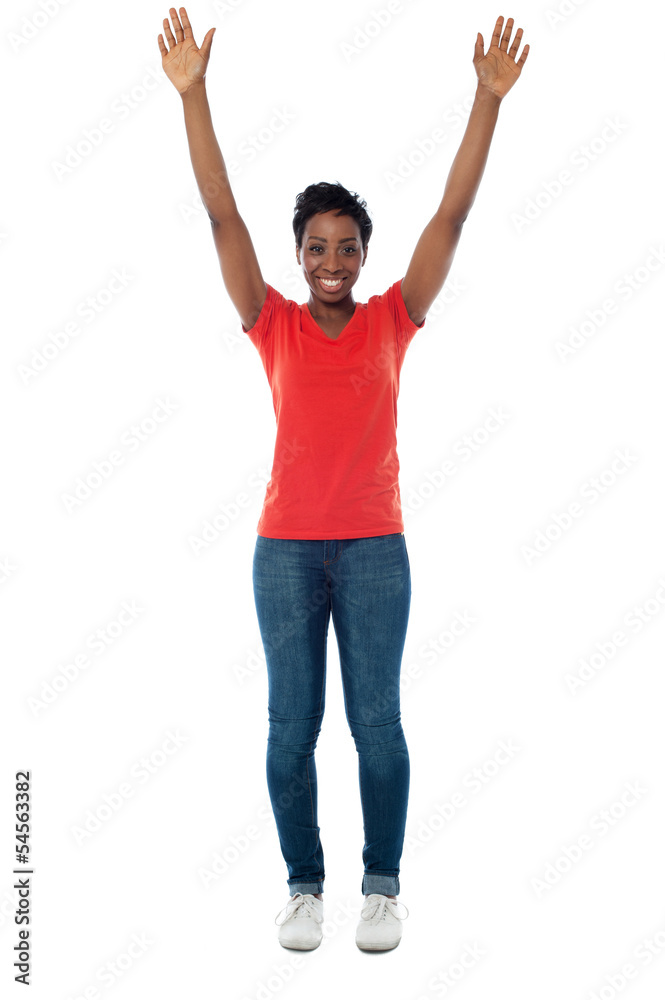 Excited woman raising her arms up Excited woman raising her arms up