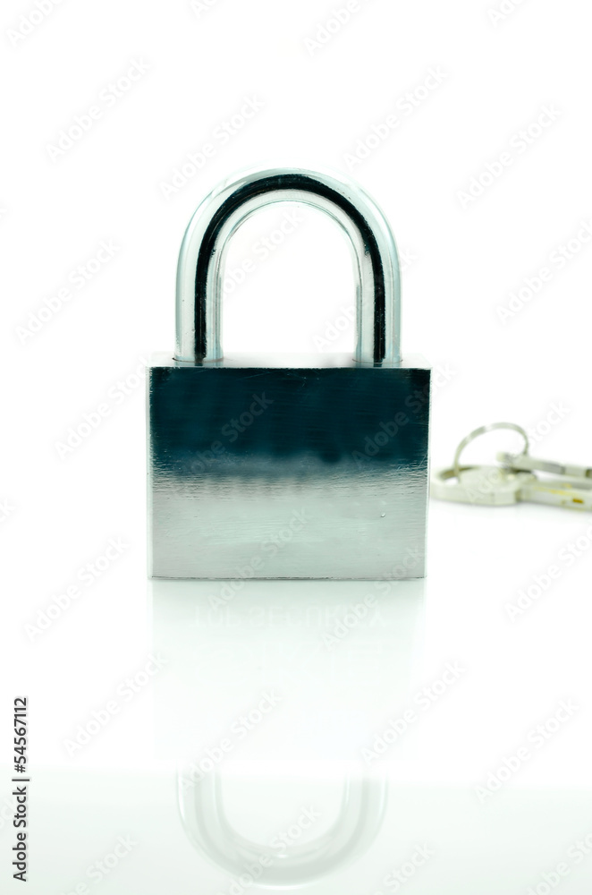 Closed padlock with key on a white background with reflections..