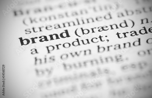 Macro image of dictionary definition of brand