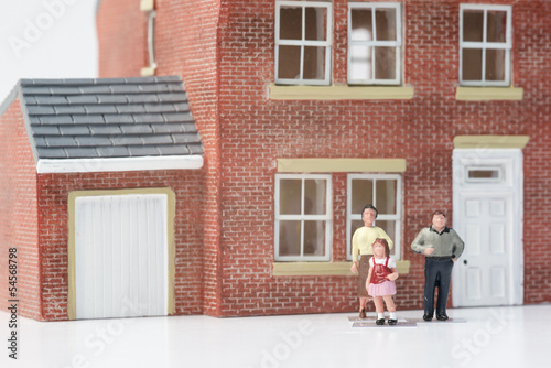 Family home concept with model house and people on white backgro