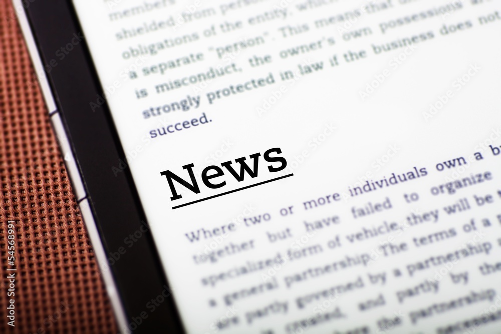 Obraz premium News on tablet screen, ebook concept