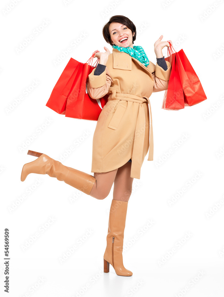 Portrait of happy woman with shopping bags in autumn coat Portrait of happy woman with shopping bags in autumn coat