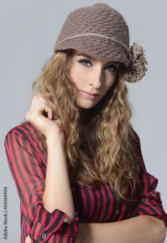 portrait of beautiful blond girl with curly hair in cap portrait of beautiful blond girl with curly hair in cap