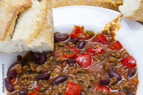 delicious home made chili con carne with bread and sour cream