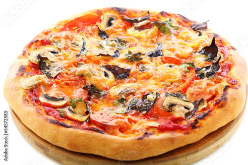 Pizza with tomatoes, mushrooms and purple basil.