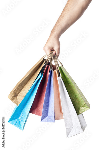 male hand holding shopping bags isolated on white background