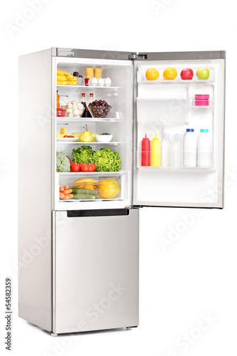 Studio shot of an open fridge full of healthy food products
