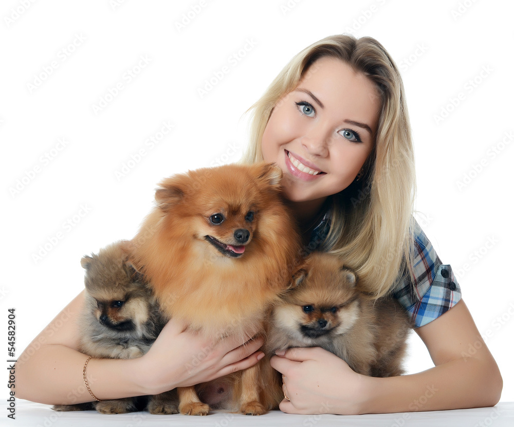 The beautiful girl with a puppy spitz