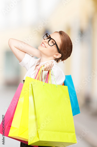 woman with shopping bags in ctiy