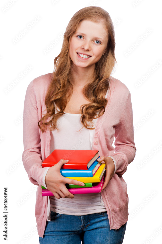 Cute young student girl holding colorful exercise books. Cute young student girl holding colorful exercise books.