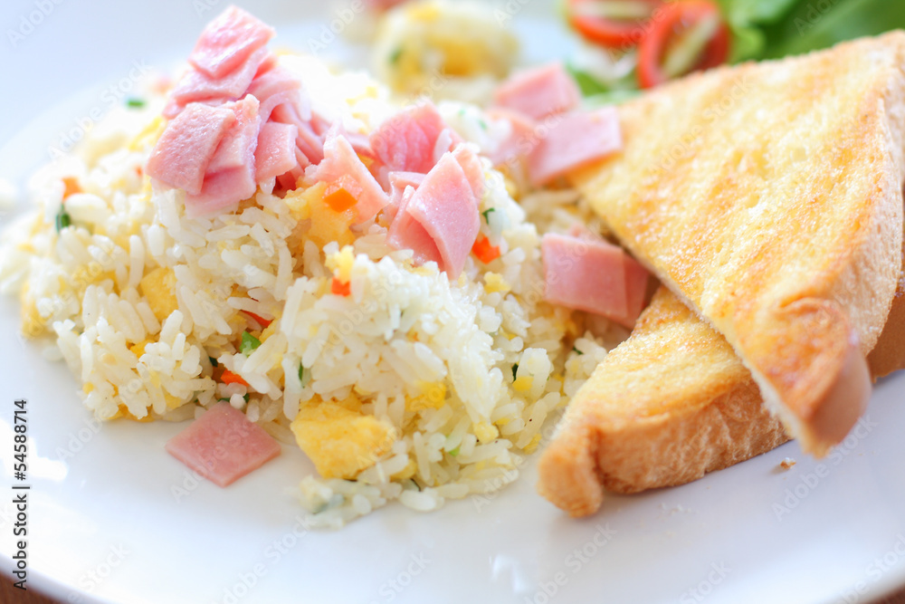 Fried rice with ham, served with toast Fried rice with ham, served with toast