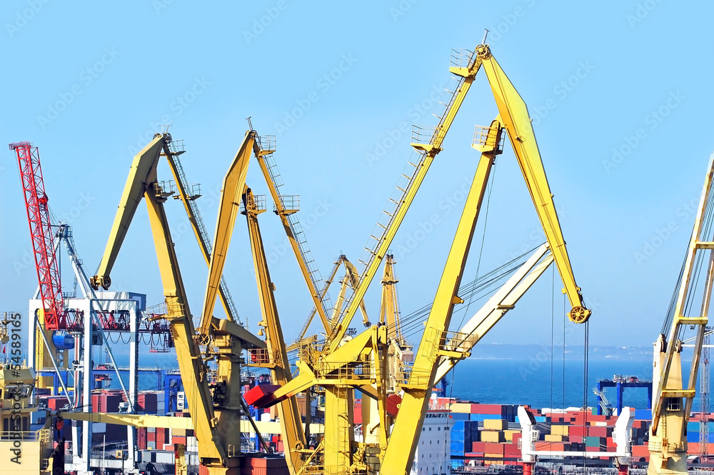 Container stack and ship under crane bridge Container stack and ship under crane bridge