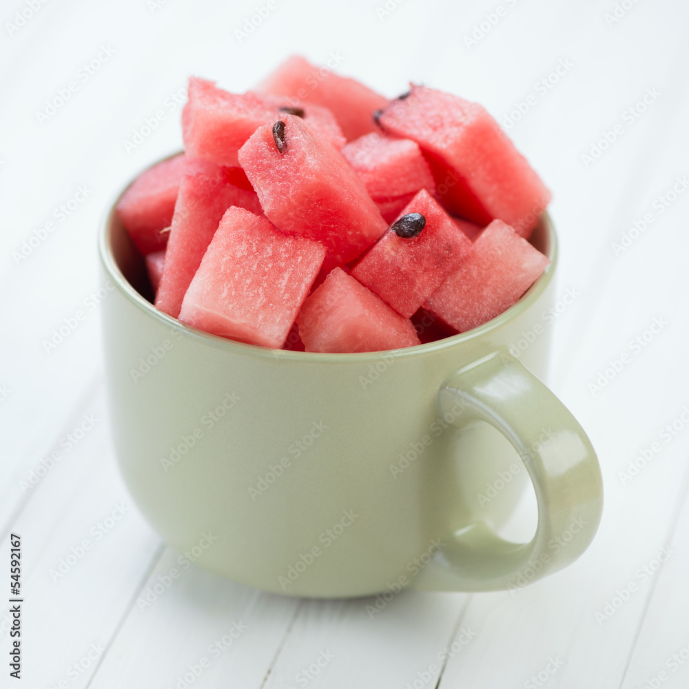 Cup with ripe watermelon cut into cubes, close-up Cup with ripe watermelon cut into cubes, close-up