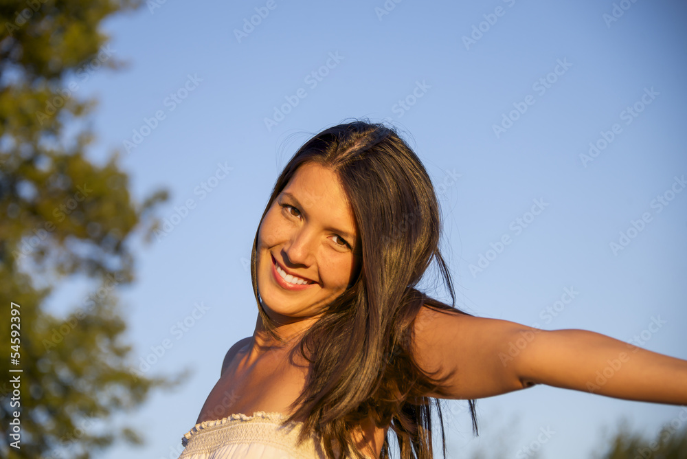 very attractive brunette woman outdoors at sunset very attractive brunette woman outdoors at sunset