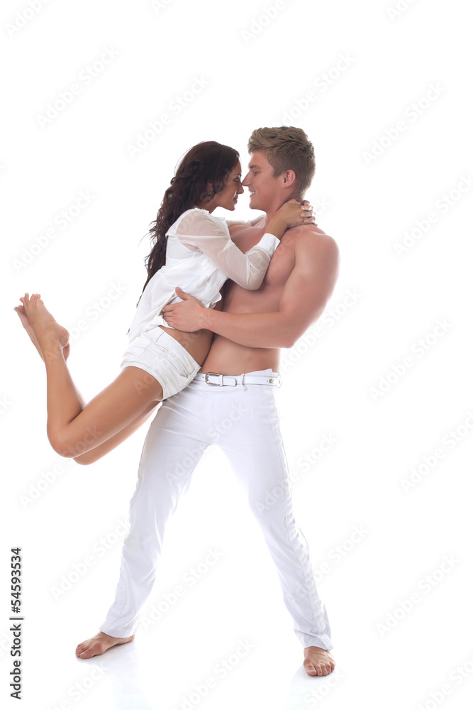 Beautiful smiling couple dancing in studio Beautiful smiling couple dancing in studio